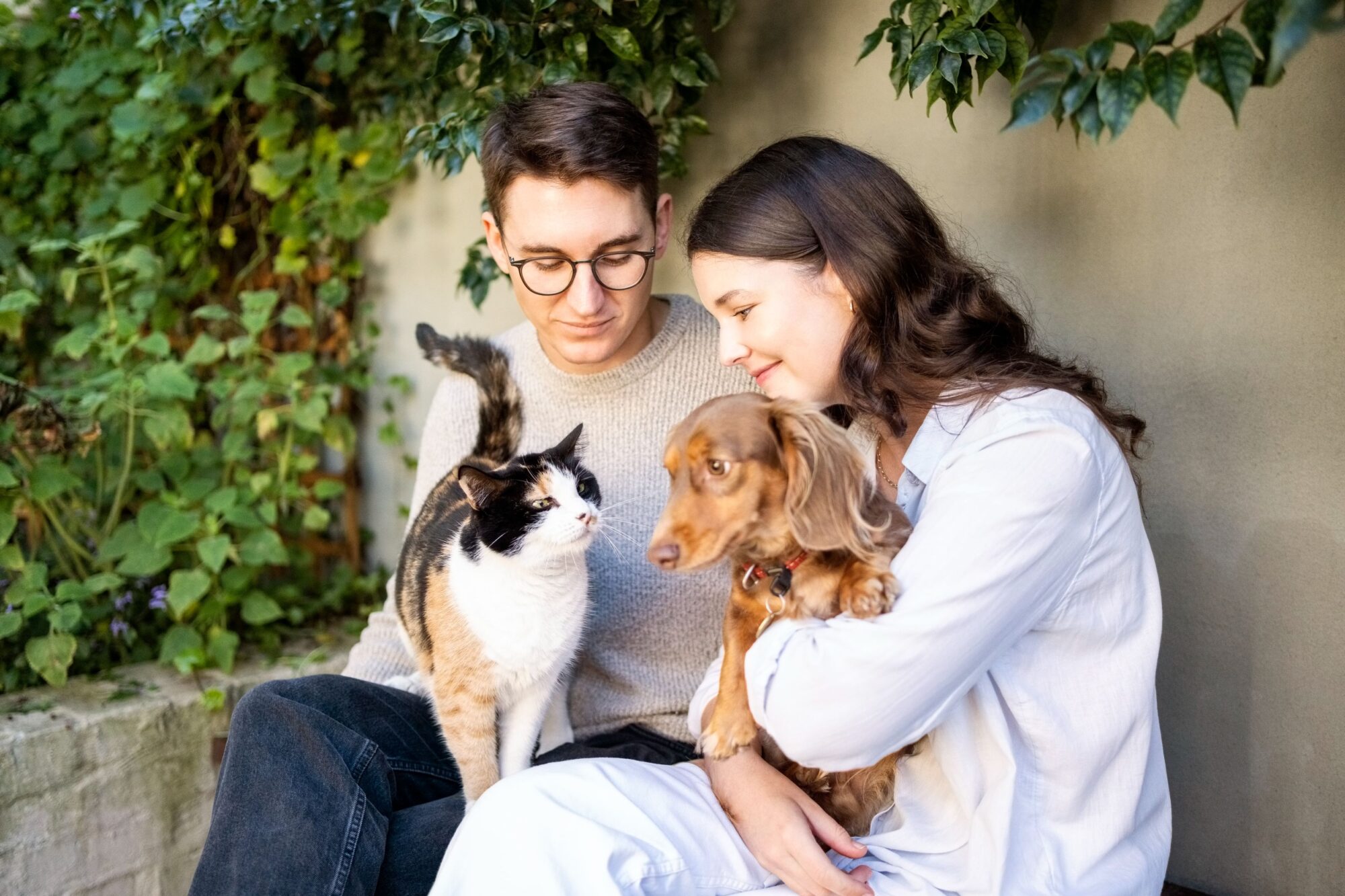 couple with dog and cat.
